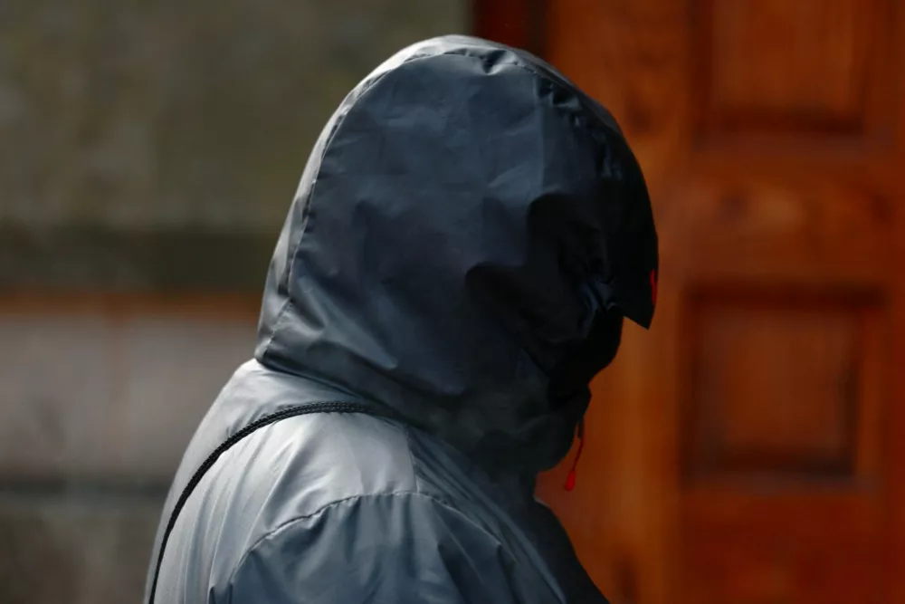 A man, believed to be Jonathan Kirk, one of the accused, arrives at Minshull Street Crown Court, as 13 men go on trial charged with serious sexual &zwnj;offences against the same woman, who is the wife of one of the accused, in Manchester, Britain, September 14, 2026. REUTERS/Temilade Adelaja