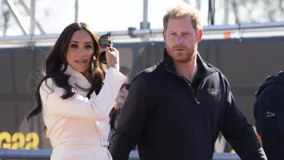 Prince Harry and Meghan Markle, Duke and Duchess of Sussex visit the track and field event at the Invictus Games in The Hague, Netherlands, Sunday, April 17, 2022. The week-long games for active servicemen and veterans who are ill, injured or wounded opened Saturday in this Dutch city that calls itself the global center of peace and justice. (AP Photo/Peter Dejong)