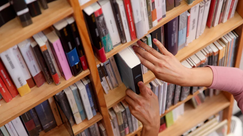 woman in the bookstore selecting books