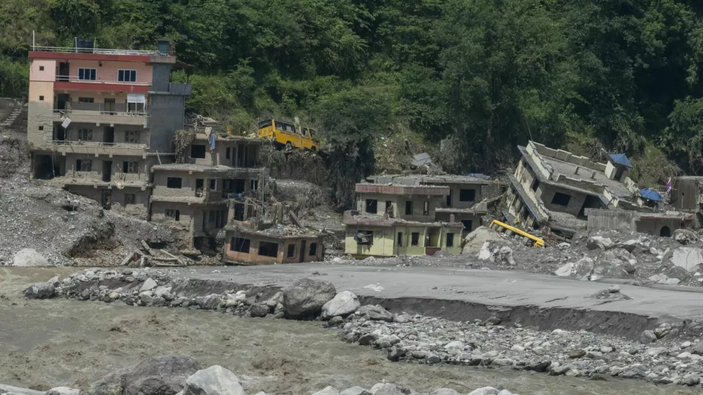 NUWAKOT, NEPAL - SEPTEMBER 14: Aftermath of devastating flash floods that struck Nepal on August 26 is seen in Nuwakot, where people in the affected areas continue to return to the ruins of their homes, searching for belongings and the last remnants of lives that were swept away, in Bagmati province, central Nepal, on September 14, 2026. Some survivors salvage whatever they can from the debris, while others stand silently at the places where their homes once stood. Religious figures visit the affected areas to hold prayers for those who died in the disaster, with some prayers continuing for a day or two, while bereaved families gather to remember their loved ones and pray for the peace of their souls. Meanwhile, families searching for missing relatives continue to visit hospitals in Kathmandu, where they look through photographs and lists of missing people displayed on hospital walls. Some use mobile phone video calls to show the photographs to family members and seek help identifying their missing loved ones, in Nuwakot, northwest of Kathmandu. Abdul Goni / AnadoluNo Use USA No use UK No use Canada No use France No use Japan No use Italy No use Australia No use Spain No use Belgium No use Korea No use South Africa No use Hong Kong No use New Zealand No use Turkey