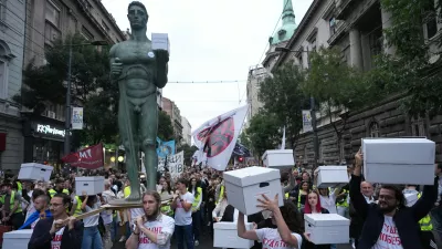 Political candidates, students and citizens carry signatures for the "Student list - Students win" to the Republic Election Commission towards participation in the upcoming parliamentary elections in Belgrade, Serbia, Monday, Sept. 14, 2026. (AP Photo/Darko Vojinovic)