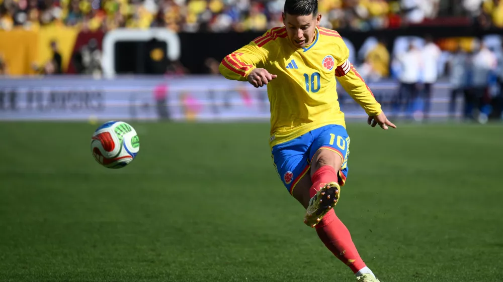 FILE - Colombia midfielder James Rodr&iacute;guez (10) plays the ball during the second half of an international friendly soccer match against France, Sunday, March 29, 2026, in Landover, Md. (AP Photo/Nick Wass, File)