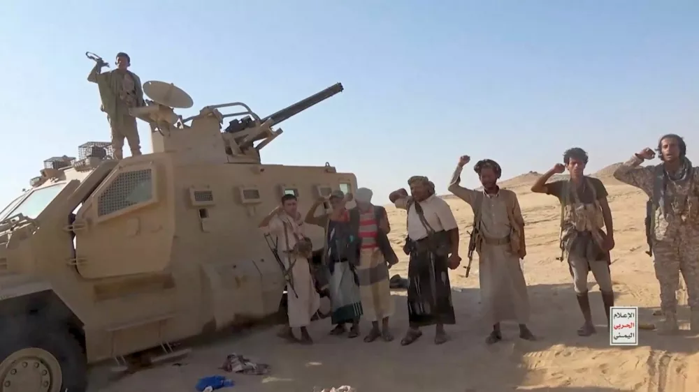 Iran-aligned Houthi fighters pose next to a captured vehicle following what the source described as an attack on Saudi-backed forces in the location given by the source as al Jawf governorate, Yemen, in this screengrab taken from a video released by Houthi Military Media on September 15, 2026. HOUTHI MILITARY MEDIA/Handout via REUTERS. THIS IMAGE HAS BEEN SUPPLIED BY A THIRD PARTY. Verification Lines: Reuters could not verify the location or exact date when the video was filmed. However, no older versions of the video were found posted online before September 15.
