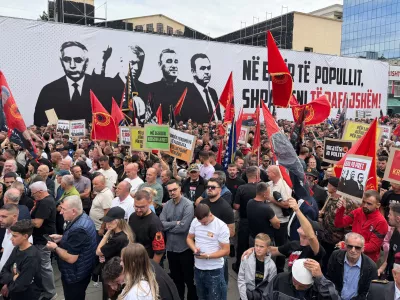 People rally in Pristina, Kosovo, Saturday, Sept. 12, 2026, in support of the former president Hashim Thaci and the other defendants, Kadri Veseli, Rexhep Selimi and Jakup Krasniqi ahead of their verdicts next week at a Netherlands-based court which tried them for alleged war crimes during a 1998-1999 separatist war from Serbia. (AP Photo/Zana Cimili)