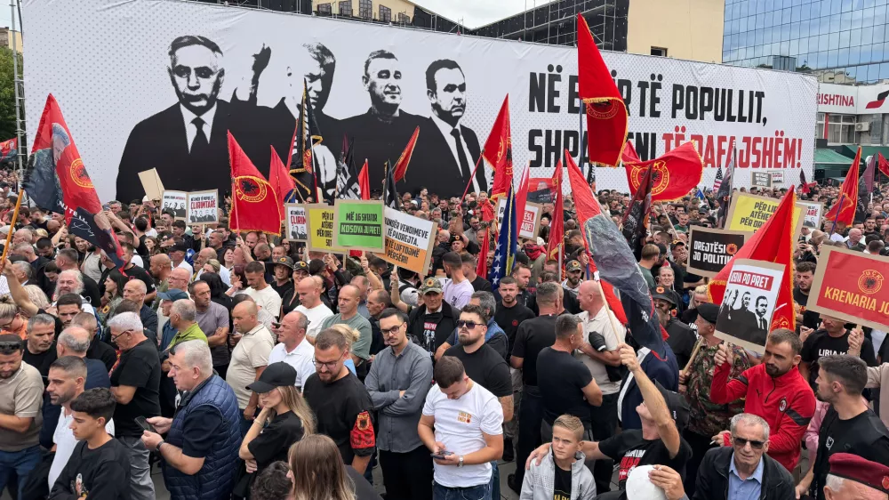 People rally in Pristina, Kosovo, Saturday, Sept. 12, 2026, in support of the former president Hashim Thaci and the other defendants, Kadri Veseli, Rexhep Selimi and Jakup Krasniqi ahead of their verdicts next week at a Netherlands-based court which tried them for alleged war crimes during a 1998-1999 separatist war from Serbia. (AP Photo/Zana Cimili)