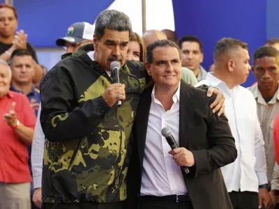 FILE - Venezuela's President Nicolas Maduro, left, and Alex Saab stand together during an event marking the anniversary of the 1958 coup that overthrew dictator Marcos Perez Jimenez, in Caracas, Venezuela, Jan. 23, 2024. (AP Photo/Jesus Vargas, File)