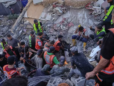 Palestinian civil defense crews search for bodies and survivors in the rubble of a collapsed building that housed displaced Palestinians and was heavily damaged during the Israel-Hamas war, in Gaza City, Wednesday, Sept. 16, 2026. (AP Photo/Jehad Alshrafi)