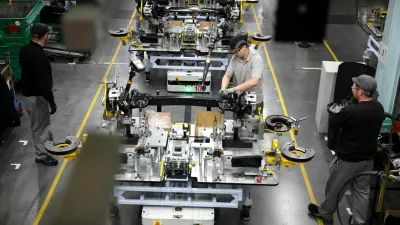 FILE PHOTO: Workers assemble components on the production line for the Qashqai model car at the Nissan car factory in Sunderland, Britain, December 16, 2025. REUTERS/Phil Noble/File Photo