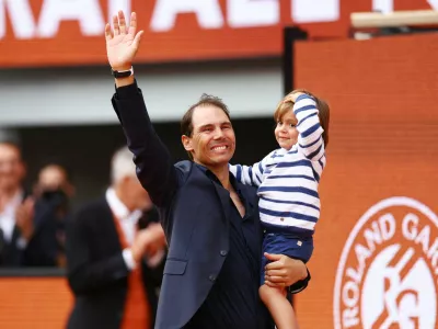Tennis - French Open - Roland Garros, Paris, France - May 25, 2025 Former tennis player and record French Open winner Spain's Rafael Nadal and his son Rafael Nadal Junior during a tribute ceremony REUTERS/Lisi Niesner