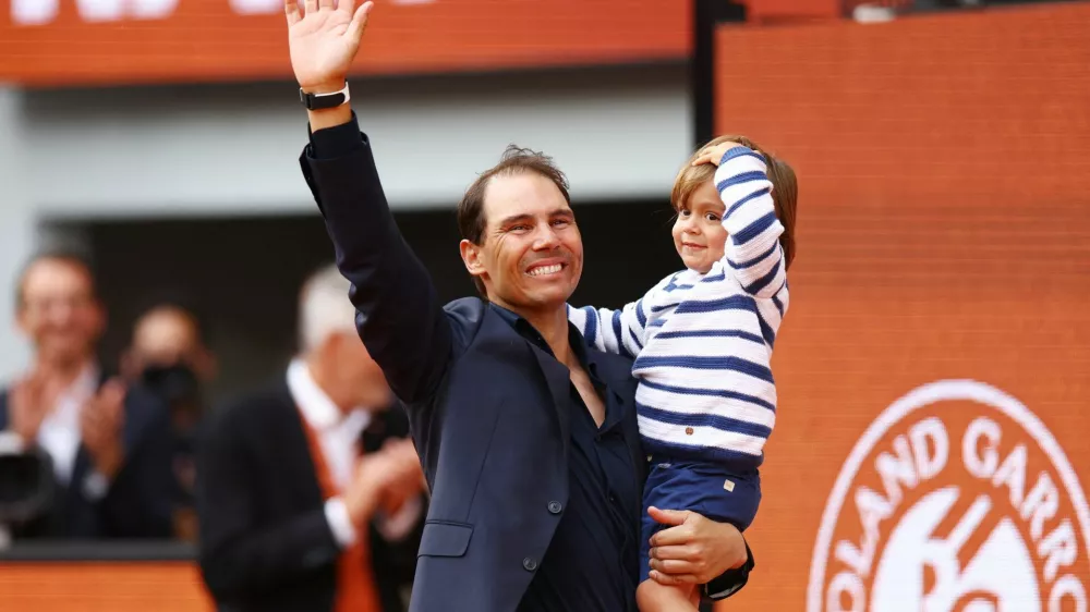 Tennis - French Open - Roland Garros, Paris, France - May 25, 2025 Former tennis player and record French Open winner Spain's Rafael Nadal and his son Rafael Nadal Junior during a tribute ceremony REUTERS/Lisi Niesner