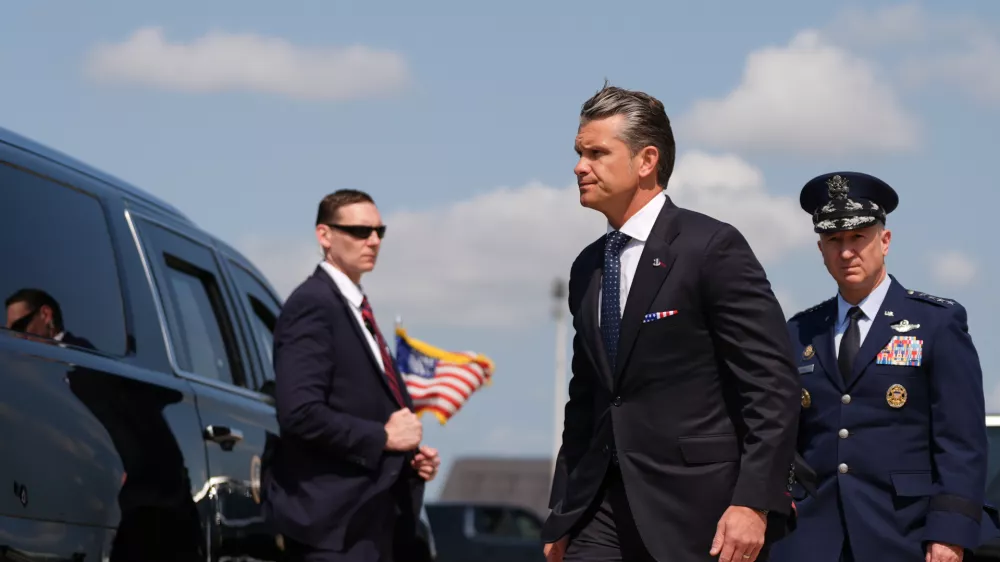 Defense Secretary Pete Hegseth, left, and Chairman of the Joint Chiefs of Staff Gen. Dan Caine, right, arrive Wednesday, July 22, 2026, at Dover Air Force Base, Del. (AP Photo/Julia Demaree Nikhinson)