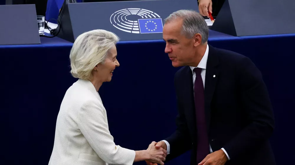 Canadian Prime Minister Mark Carney shakes hands with European Commission President Ursula von der Leyen as he attends her State of the European Union address (SOTEU) to the European Parliament, in Strasbourg, France, September 16, 2026. REUTERS/Yves Herman