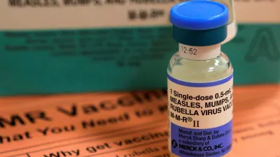FILE PHOTO: A vial of measles, mumps and rubella vaccine and an information sheet is seen at Boston Children's Hospital in Boston, Massachusetts February 26, 2015.  REUTERS/Brian Snyder/File Photo