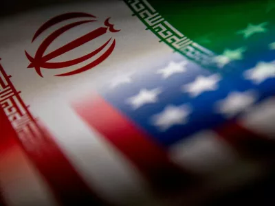 FILE PHOTO: The Iranian and U.S. flags are seen printed on paper in this illustration taken January 27, 2022. REUTERS/Dado Ruvic/Illustration/File Photo