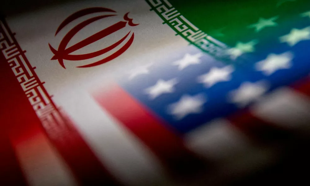 FILE PHOTO: The Iranian and U.S. flags are seen printed on paper in this illustration taken January 27, 2022. REUTERS/Dado Ruvic/Illustration/File Photo