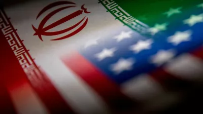 FILE PHOTO: The Iranian and U.S. flags are seen printed on paper in this illustration taken January 27, 2022. REUTERS/Dado Ruvic/Illustration/File Photo