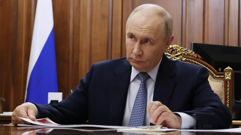 Russian President Vladimir Putin listens to the Head of the Russian Federal Service for the Oversight of Consumer Protection and Welfare (Rospotrebnadzor) Anna Popova at the Kremlin in Moscow, Tuesday, Sept. 15, 2026. (Vyacheslav Prokofyev/Sputnik, Kremlin Pool Photo via AP)