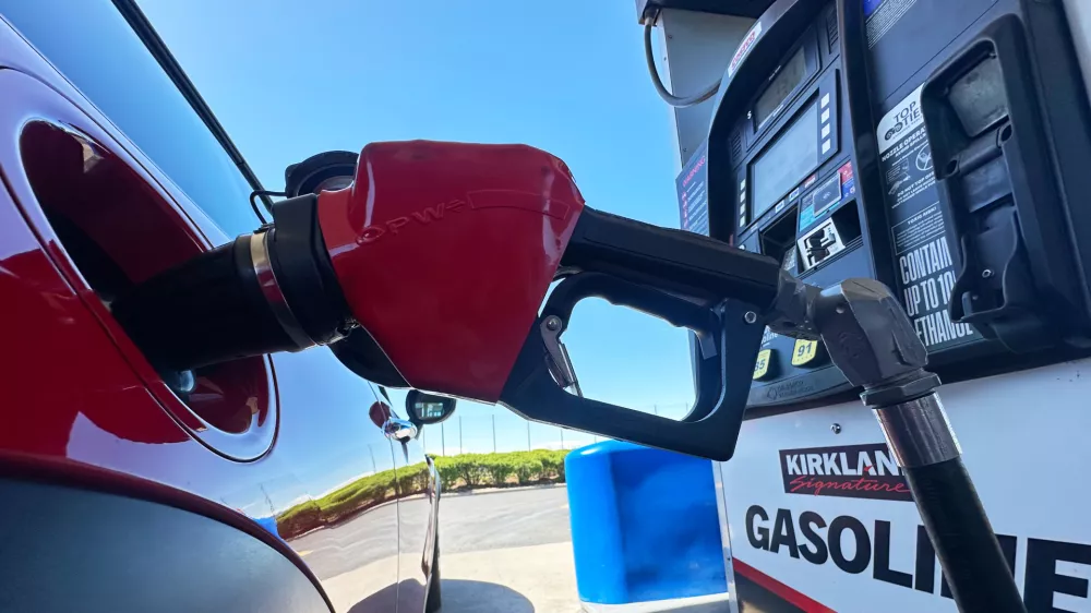 FILE - A motorist fills up the tank of a vehicle at a Costco gasoline station Wednesday, April 15, 2026, in Sheridan, Colo. (AP Photo/David Zalubowski, file)