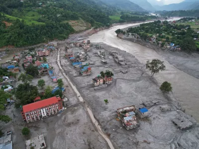 FILE - Homes are engulfed in mud in the aftermath of flash flooding along the Trishuli River in the Devighat area of Nuwakot district, Nepal, Aug. 29, 2026. (AP Photo/Rajesh Kumar Singh, File)