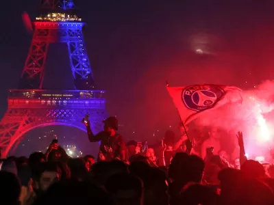 PSG supporters celebrate in Paris, Saturday, May 30, 2026 after the Champions League final soccer match between Paris Saint-Germain and Arsenal that's being played in Budapest, PSG won the match. (AP Photo/Thomas Padilla)