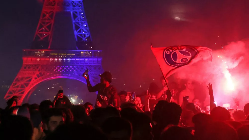 PSG supporters celebrate in Paris, Saturday, May 30, 2026 after the Champions League final soccer match between Paris Saint-Germain and Arsenal that's being played in Budapest, PSG won the match. (AP Photo/Thomas Padilla)
