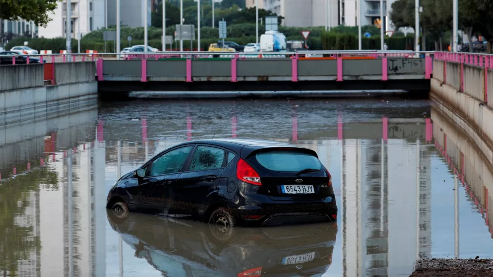 A car partially submerged at the entrance of a flooded underpass after heavy rain in Torrent, near Valencia, Spain, September 17, 2026. REUTERS/Eva Manez