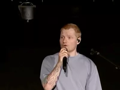 Singer Ed Sheeran speaks on stage as he addresses a controversy over Macklemore being pulled from the tour after saying "Free Palestine" at a show early this month, in Philadelphia, Pennsylvania, US September 19, 2026, in this screen grab obtained from a video. Ed Sheeran via Instagram/Handout via REUTERS THIS IMAGE HAS BEEN SUPPLIED BY A THIRD PARTY. NO RESALES. NO ARCHIVES. MANDATORY CREDIT.