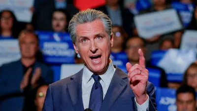 FILE PHOTO: California Governor Gavin Newsom, along with local congressional representatives, state officials and supporters, speaks as he announces the redrawing of California's congressional maps, calling on voters to approve a ballot measure, in response to a similar move in Texas being supported by U.S. President Donald Trump, in Los Angeles, California, U.S., August 14, 2025. REUTERS/Mike Blake/File Photo