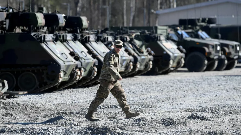 FILE PHOTO: A member of the military walks at the US army base at Grafenwoehr, Germany March 11, 2022. REUTERS/Andreas Gebert/File Photo