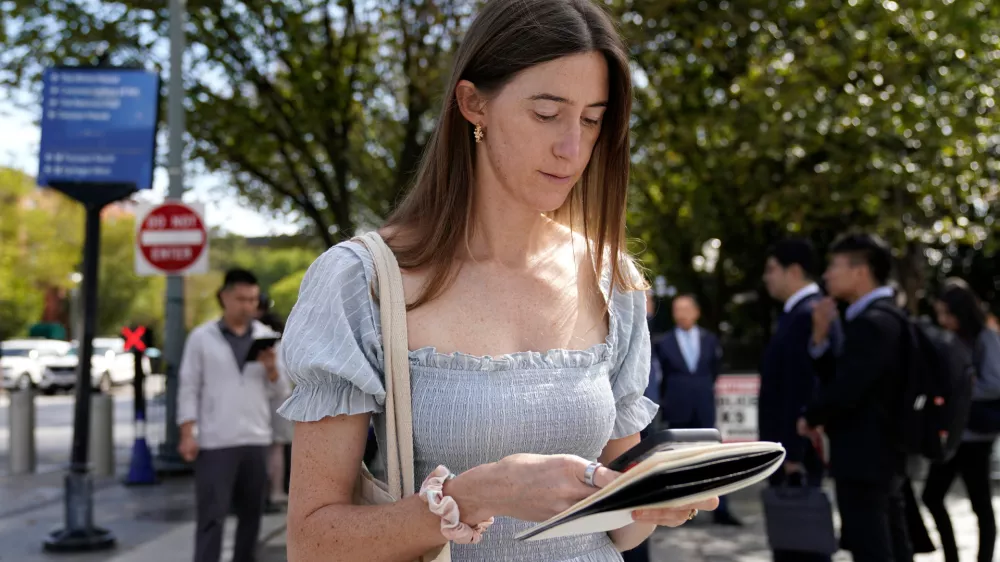 Politico White House reporter Cheyenne Haslett is pictured near the White House complex after having her credential revoked following President Donald Trump's ban on CNN, MS NOW and Politico, Saturday, Sept. 19, 2026, in Washington. (AP Photo/Jose Luis Magana)