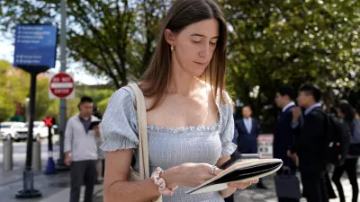 Politico White House reporter Cheyenne Haslett is pictured near the White House complex after having her credential revoked following President Donald Trump's ban on CNN, MS NOW and Politico, Saturday, Sept. 19, 2026, in Washington. (AP Photo/Jose Luis Magana)