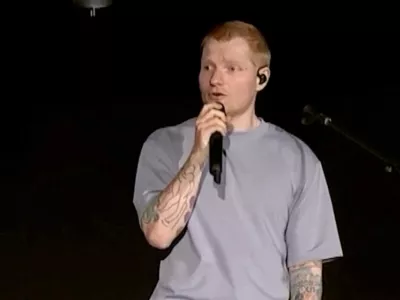 Singer Ed Sheeran speaks on stage as he addresses a controversy over Macklemore being pulled from the tour after saying "Free Palestine" at a show early this month, in Philadelphia, Pennsylvania, US September 19, 2026, in this screen grab obtained from a video. Ed Sheeran via Instagram/Handout via REUTERS THIS IMAGE HAS BEEN SUPPLIED BY A THIRD PARTY. NO RESALES. NO ARCHIVES. MANDATORY CREDIT.   TPX IMAGES OF THE DAY