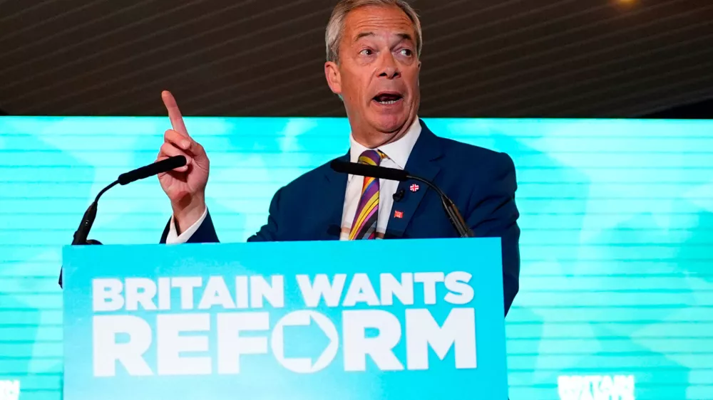 Reform UK leader Nigel Farage speaks to supporters at Chelmsford City Racecourse, Friday May 8, 2026, in Essex, England, following the 2026 local election results. (Jordan Pettitt/PA via AP)