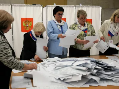 Members of a local electoral commission count votes after the closure of a polling station on the final day of Russia's three-day parliamentary election in the town of Podolsk near Moscow, Russia, September 20, 2026. REUTERS/Ramil Sitdikov