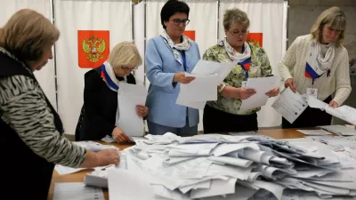 Members of a local electoral commission count votes after the closure of a polling station on the final day of Russia's three-day parliamentary election in the town of Podolsk near Moscow, Russia, September 20, 2026. REUTERS/Ramil Sitdikov