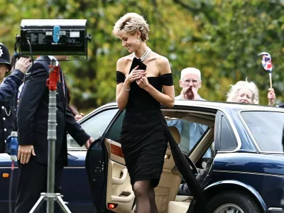 EXCLUSIVE: NO WEB BEFORE 10PM GMT 6TH NOV 2021 -- *PREMIUM EXCLUSIVE RATES APPLY* Actress Elizabeth Debicki pictured as Princess Diana wearing her 'Revenge Dress' at Vanity Fair's annual fundraising gala for the Serpentine Gallery while filming hit Netflix TV series 'The Crown'.The dress, created by Greek fashion designer Christina Stambolian, is one of the most famous dresses the late Princess wore. The form fitting, off-the-shoulder chiffon cocktail dress was worn in June 1994. The same night Diana wore the dress to the Serpentine party, her estranged husband, Prince Charles, confessed on national television that he had been unfaithful to her.Pictured: Elizabeth Debicki,Image: 641835709, License: Rights-managed, Restrictions:, Model Release: no, Pictured: Elizabeth Debicki 