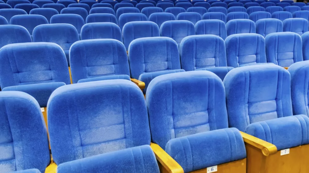 Rows of empty blue velvet seat in theater. Concept of social distancing and waiting for event start. Modern auditorium interior for cinema, conference, lecture and performance show,Image: 1129819509, License: Royalty-free, Restrictions:, Model Release: no 