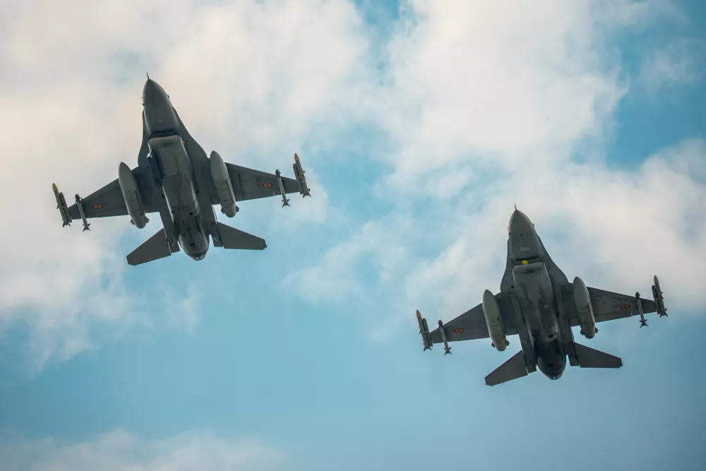 Romanian F-16 fighter jets fly during an air policing exercise at Borcea Air Base 86, amid heightened security concerns over cross-border drone incursions linked to Russia's war in Ukraine, in Borcea, Romania, Friday, Aug. 7, 2026. (AP Photo/ Vadim Ghirda)