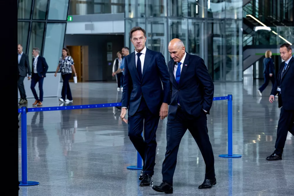 NATO Secretary General Mark Rutte, left, and Slovenian Prime Minister Janez Jansa speak to each other prior to a meeting at NATO headquarters in Brussels, Monday, Sept. 14, 2026. (AP Photo/Omar Havana)