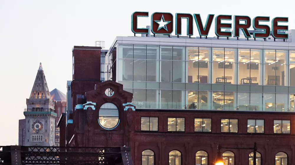 FILE - The Converse logo is displayed on the roof of the company's world headquarters in the West End neighborhood of Boston, Wednesday, Dec. 28, 2016. (AP Photo/Charles Krupa, file)