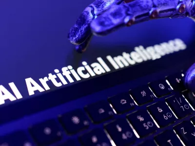 FILE PHOTO: Words "AI Artificial Inteligence", keyboard, and a robotic hand in this illustration taken June 5, 2026. REUTERS/Dado Ruvic/Illustration/File Photo