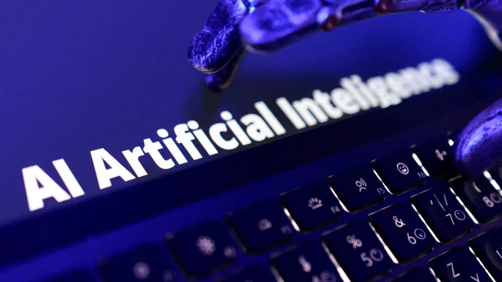 FILE PHOTO: Words "AI Artificial Inteligence", keyboard, and a robotic hand in this illustration taken June 5, 2026. REUTERS/Dado Ruvic/Illustration/File Photo