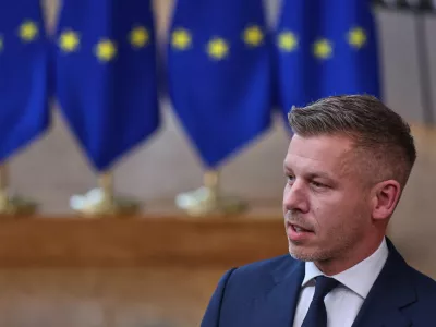 Hungary's Prime Minister Peter Magyar talks to journalists as he arrives for the EU summit in Brussels, Thursday, June 18, 2026. (AP Photo/Omar Havana)