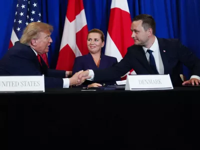 President Donald Trump shakes hands with Greenland's Prime Minister Jens-Frederik Nielsen, before signing a security agreement during the United Nations General Assembly, Tuesday, Sept. 22, 2026, at the UN headquarters, as Denmark's Prime Minister Mette Frederiksen, center, looks on. (AP Photo/Julia Demaree Nikhinson)