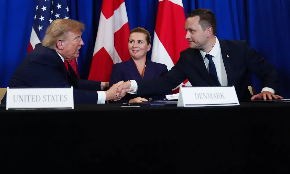 President Donald Trump shakes hands with Greenland's Prime Minister Jens-Frederik Nielsen, before signing a security agreement during the United Nations General Assembly, Tuesday, Sept. 22, 2026, at the UN headquarters, as Denmark's Prime Minister Mette Frederiksen, center, looks on. (AP Photo/Julia Demaree Nikhinson)