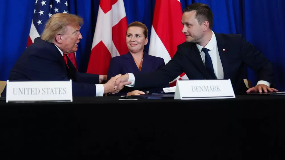 President Donald Trump shakes hands with Greenland's Prime Minister Jens-Frederik Nielsen, before signing a security agreement during the United Nations General Assembly, Tuesday, Sept. 22, 2026, at the UN headquarters, as Denmark's Prime Minister Mette Frederiksen, center, looks on. (AP Photo/Julia Demaree Nikhinson)