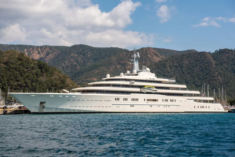 Marmaris, Turkey - March 23, 2022. M/Y Eclipse superyacht owned by Russian oligarch Roman Abramovich, in Netsel Marina port of Marmaris, Turkey. Built by Blohm+Voss of Hamburg, Germany and delivered to Abramovich on 9 December 2010, the yacht is the fourth longest afloat. The yacht's cost has been estimated at 340 million. Eclipse has two helicopter pads, 24 guest cabins, two swimming pools, several hot tubs, and a disco hall. It is also equipped with three launch boats and a mini-submarine that is capable of submerging to 50 metres (160 ft). Approximately 70 crew members are needed to operate the yacht and serve the guests. / Foto: Alizadastudios