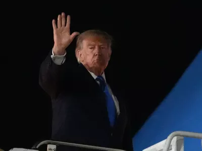 President Donald Trump boards Air Force One at John F. Kennedy International Airport, Tuesday, Sept. 22, 2026, in New York. (AP Photo/Julia Demaree Nikhinson)