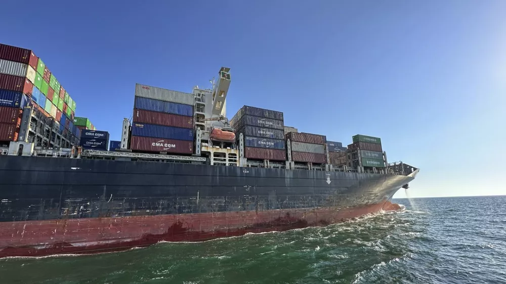 In this photo provided by Ukraine's Infrastructure Ministry Press Office, container ship Joseph Schulte (Hong Kong flag) leaves the port of Odesa to proceed through the temporary corridor established for merchant vessels from Ukraine's Black Sea ports in Odesa, Ukraine, Wednesday, Aug. 16, 2023. The ship carrying over 30 thousand tons of cargo, including food products, which had been in the port of Odesa since last February because of the Russian invasion of Ukraine, left Odessa under an agreement between Ukraine and the International Maritime Organisation. (Ukraine's Infrastructure Ministry Press Office via AP)