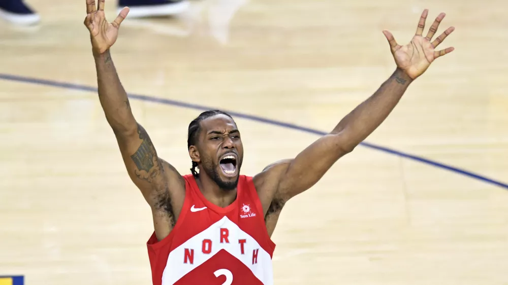 Toronto Raptors' Kawhi Leonard celebrates after the buzzer as the Raptors defeated the Golden State Warriors 114-110 during Game 6 of basketball&acirc;&euro;&trade;s NBA Finals, Thursday, June 13, 2019, in Oakland, Calif. The Raptors won the finals. (Frank Gunn/The Canadian Press via AP)